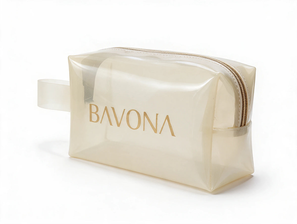 The Bavona Ritual Pouch seen from a three-quarter angle, showing the carry loop and gold-toned zip